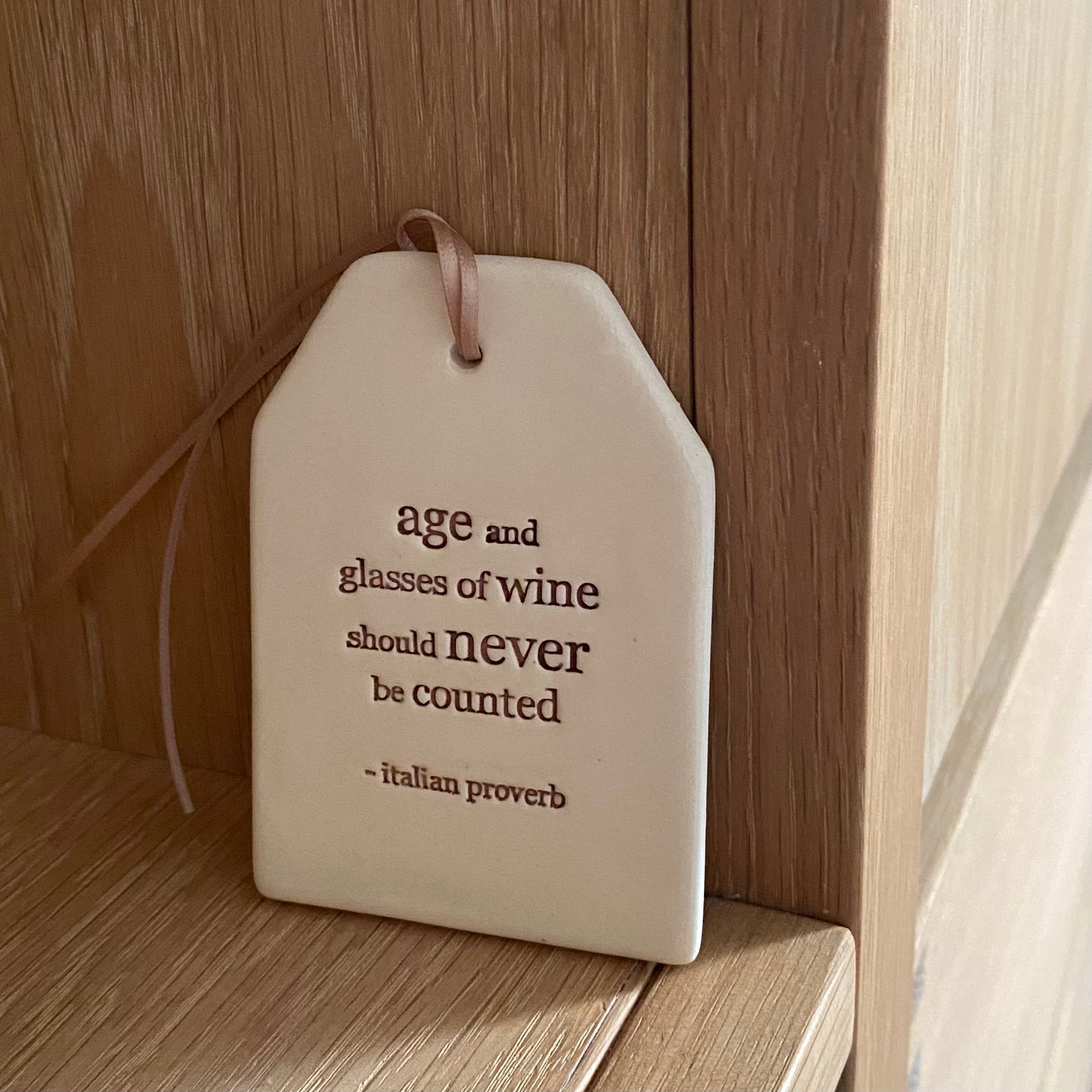 Paper Boat Press quote tag - age and glasses of wine...